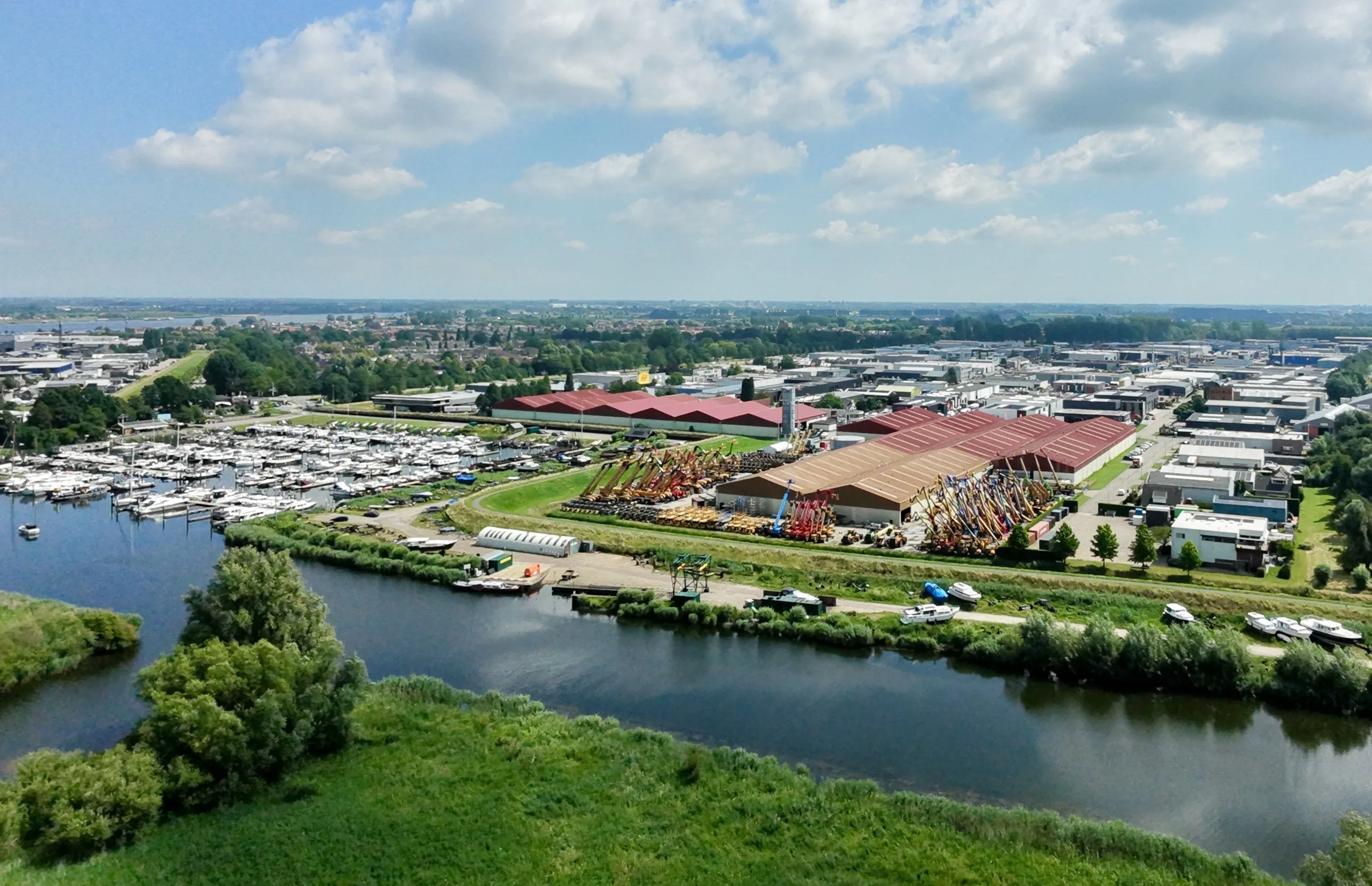 Aerial drone view of Magnet Loop's waterfront logistics site with harbour and warehousing